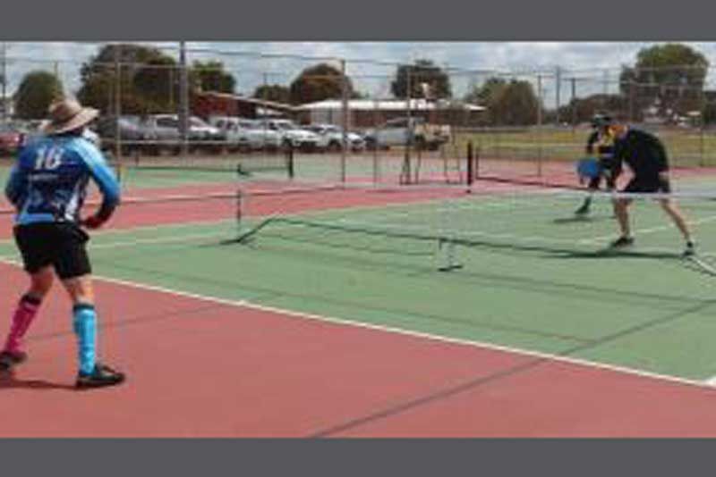 Players competing in Pickle Ball, which is played regularly in Home Hill Tennis fixtures on a half court setup