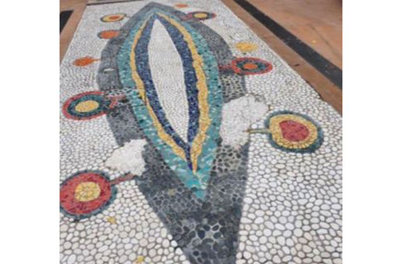 Comfort Stop mosaic water feature showing damage