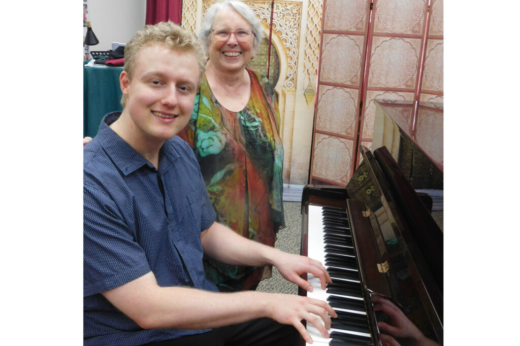 Sam Row at his Piano Recital at The Vault in Home Hill with his former music teacher Mrs Marie Finn