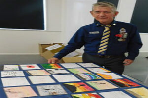 Alan Peterson with Post Cards of Honour